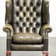 Vintage cowhide leather Chesterfield wingback armchair in a green colour