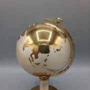 Vintage brass globe cigarette dispenser