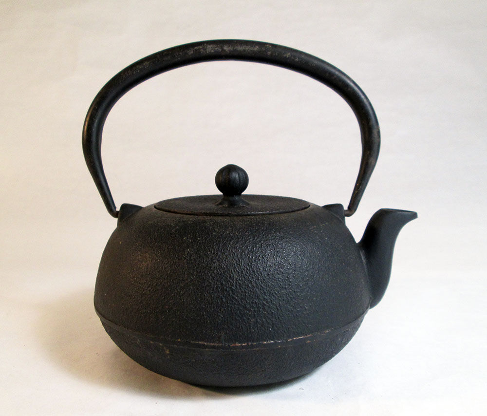 Black cast iron teapot