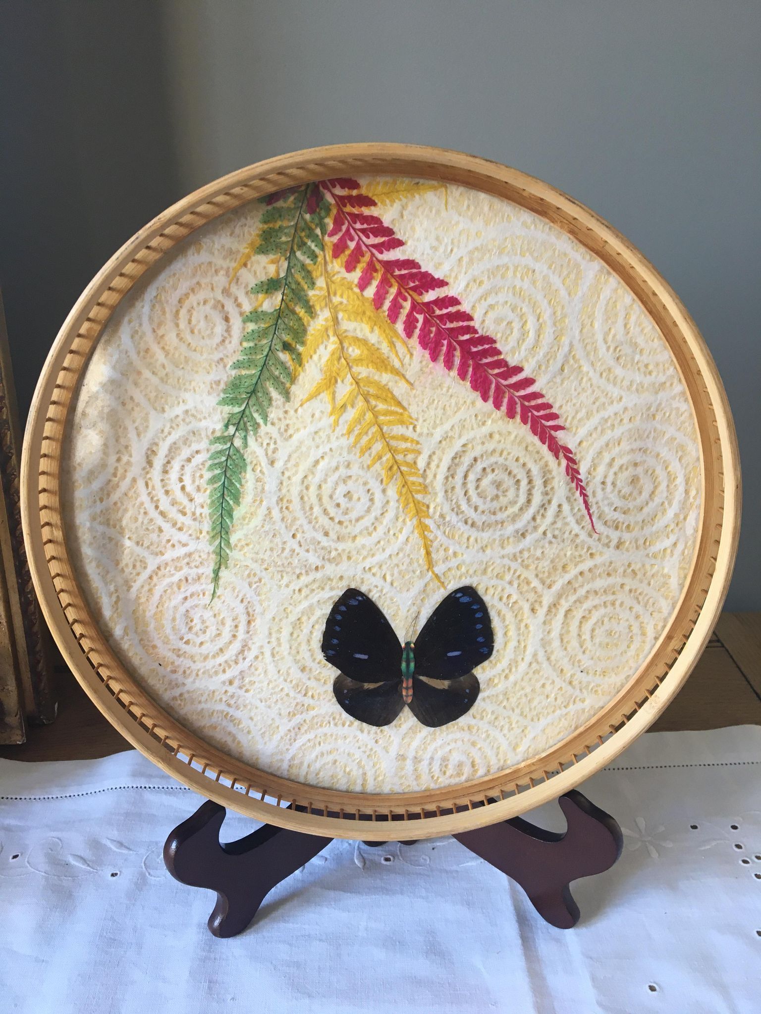 Vintage bamboo tray decorated with ferns and butterflies