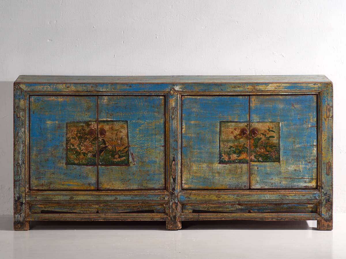 Old wooden entrance buffet in blue and yellow tones (circa 1920).