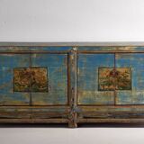 Old wooden entrance buffet in blue and yellow tones (circa 1920).