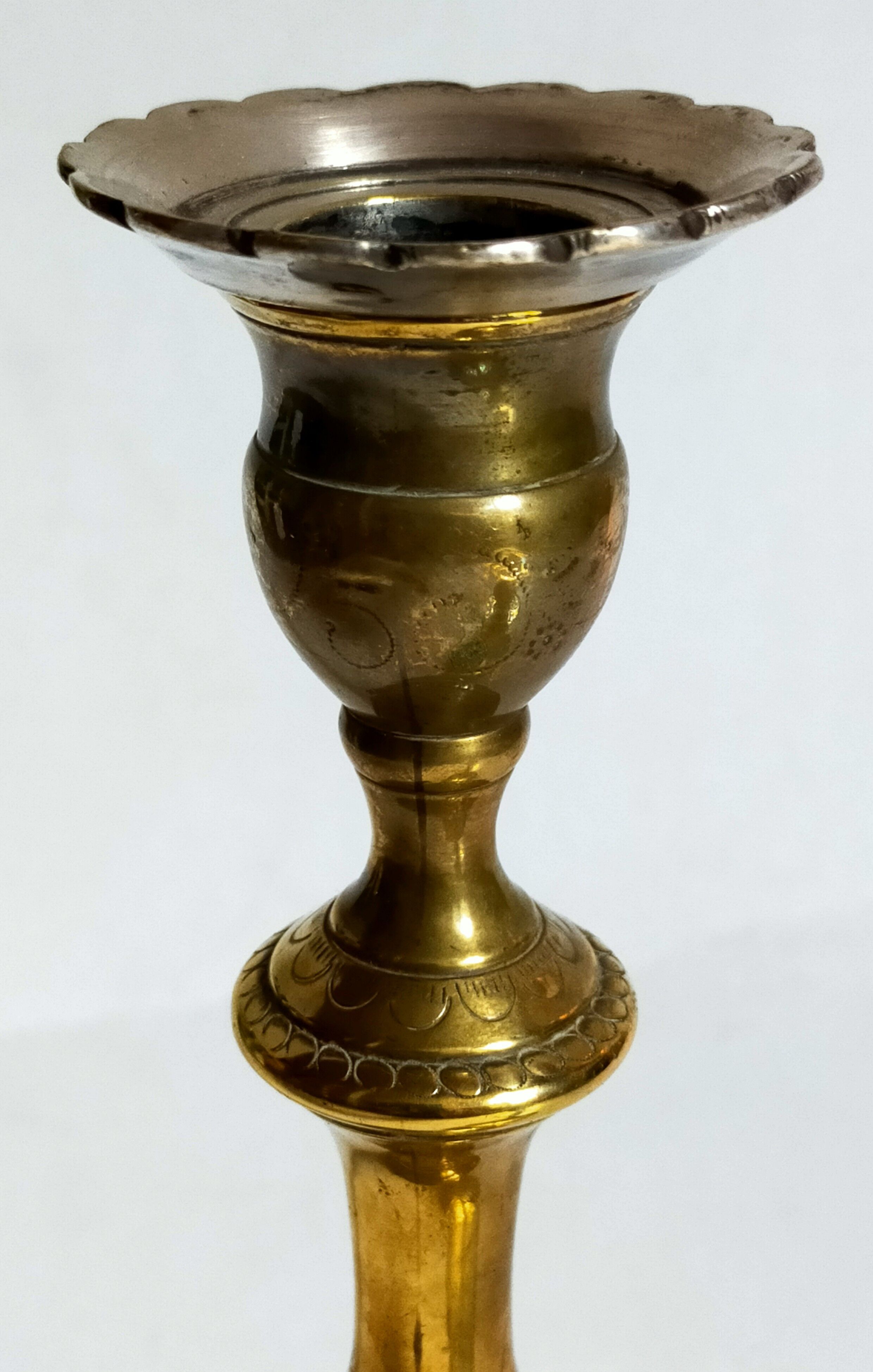 Duo of solid brass and gold metal candle holders worked old