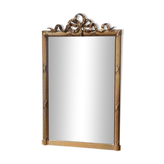 Antique gilded mirror with knot pediment