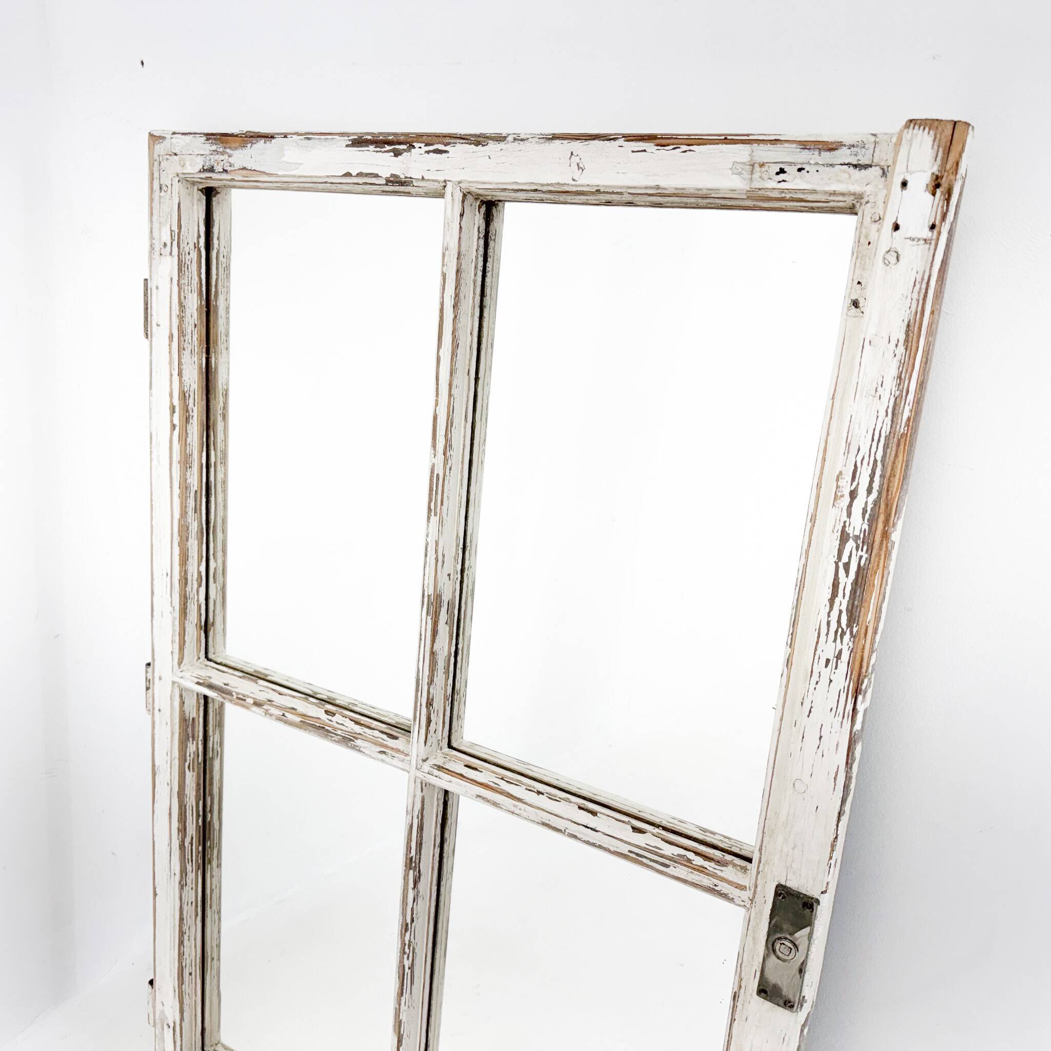 Vintage wooden window converted to a mirror