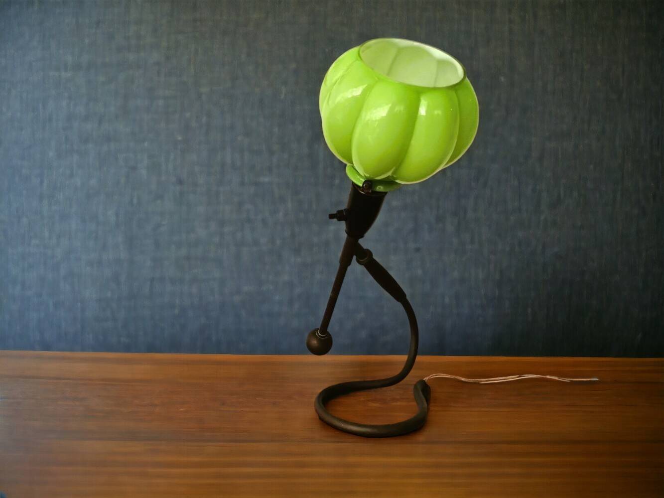 Modernist green cased glass and brass articulated table lamp