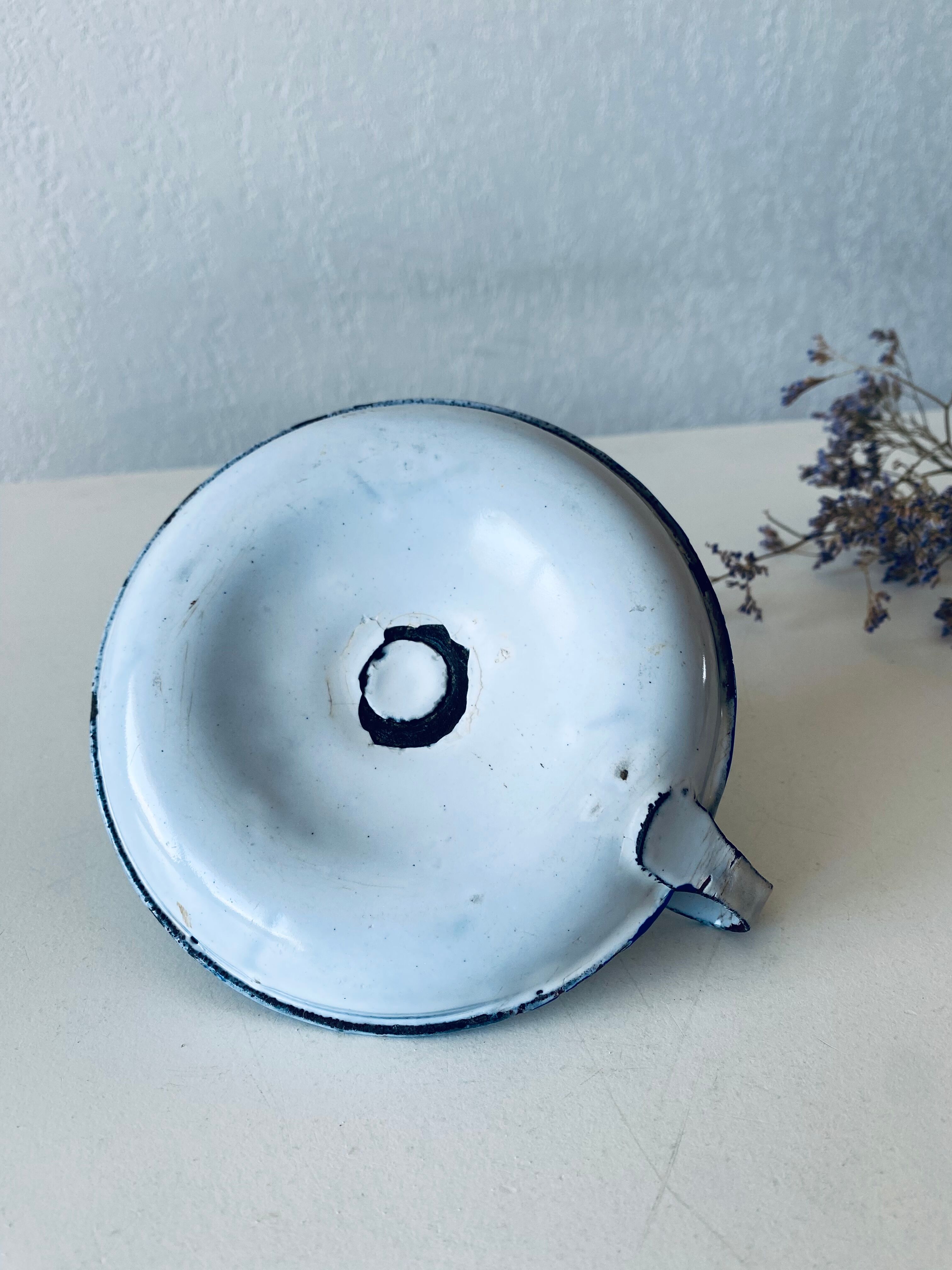 Antique candle holder in white and blue enamelled metal