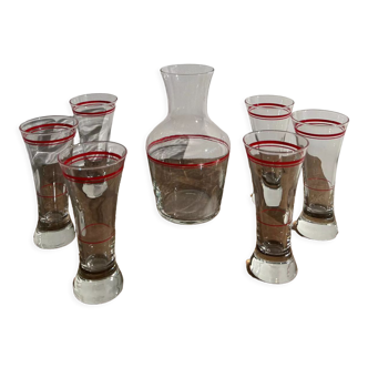 Vintage glass decanter with red edging and its 6 glasses