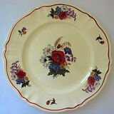 Circular dish with floral decoration and twisted edges