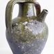 Ancient oil jar in glazed terracotta, khaki green — Auvergne, Lezou