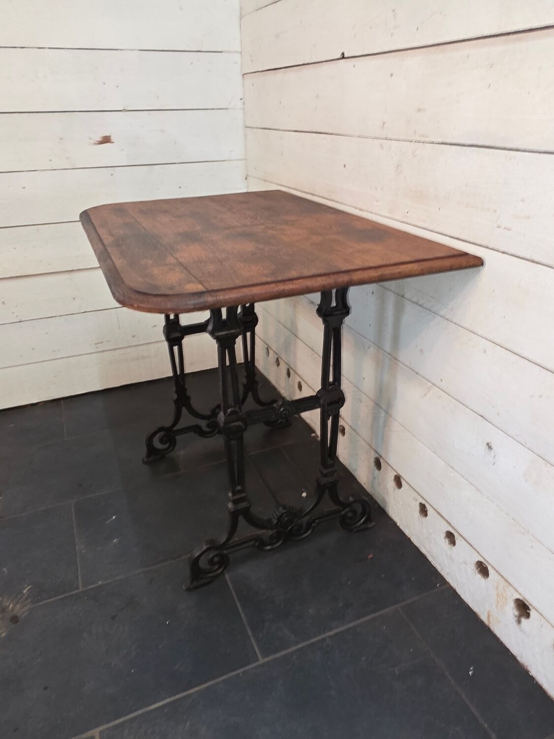 Bistro table with cast iron legs and oak top