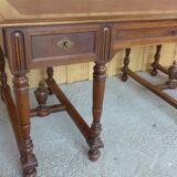Flat walnut desk with eight feet turned