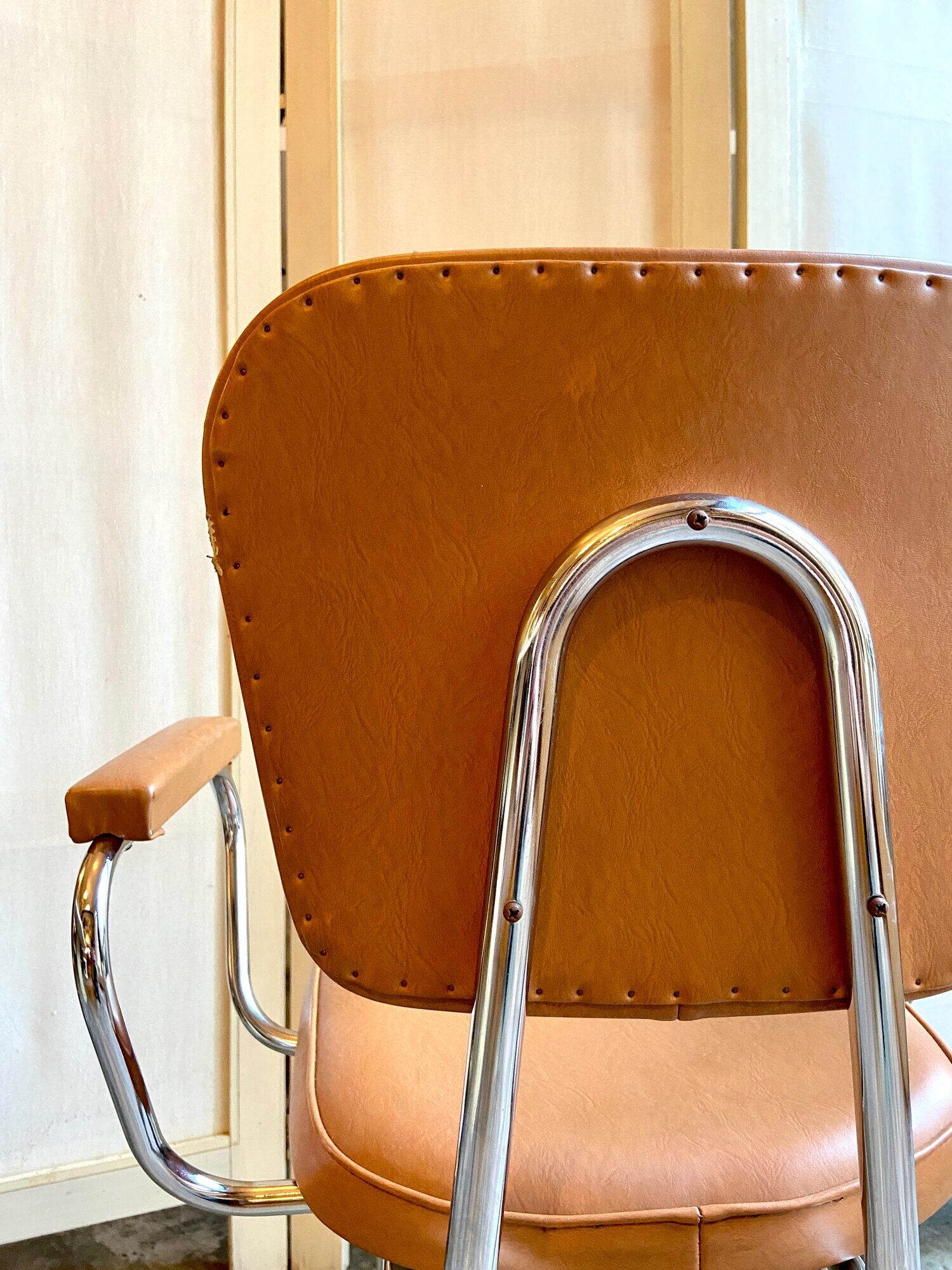 Armchair in chromed metal and tawny skaï 1950s