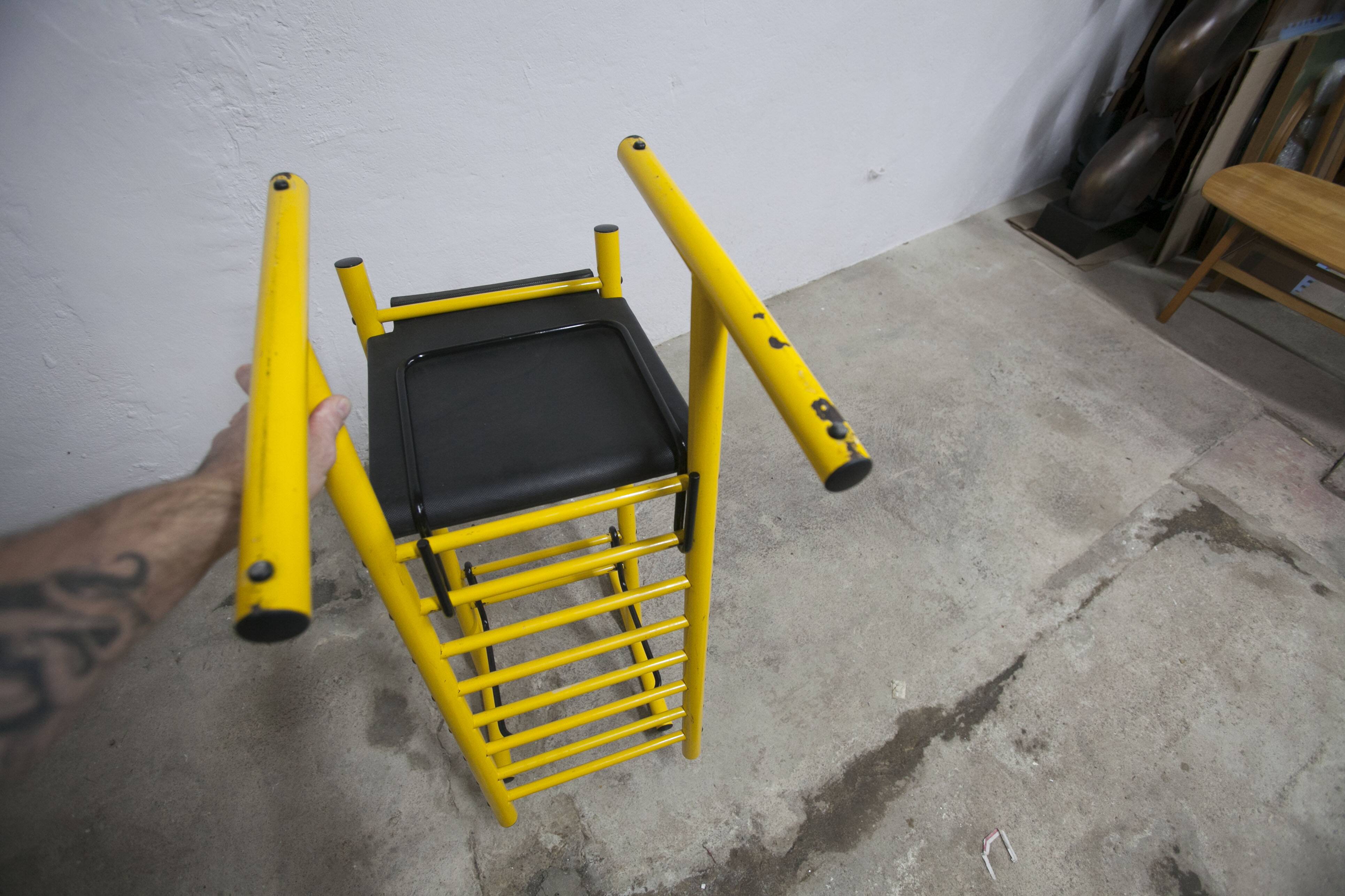 Pair of adjustable Italian bar stools in lacquered yellow and black