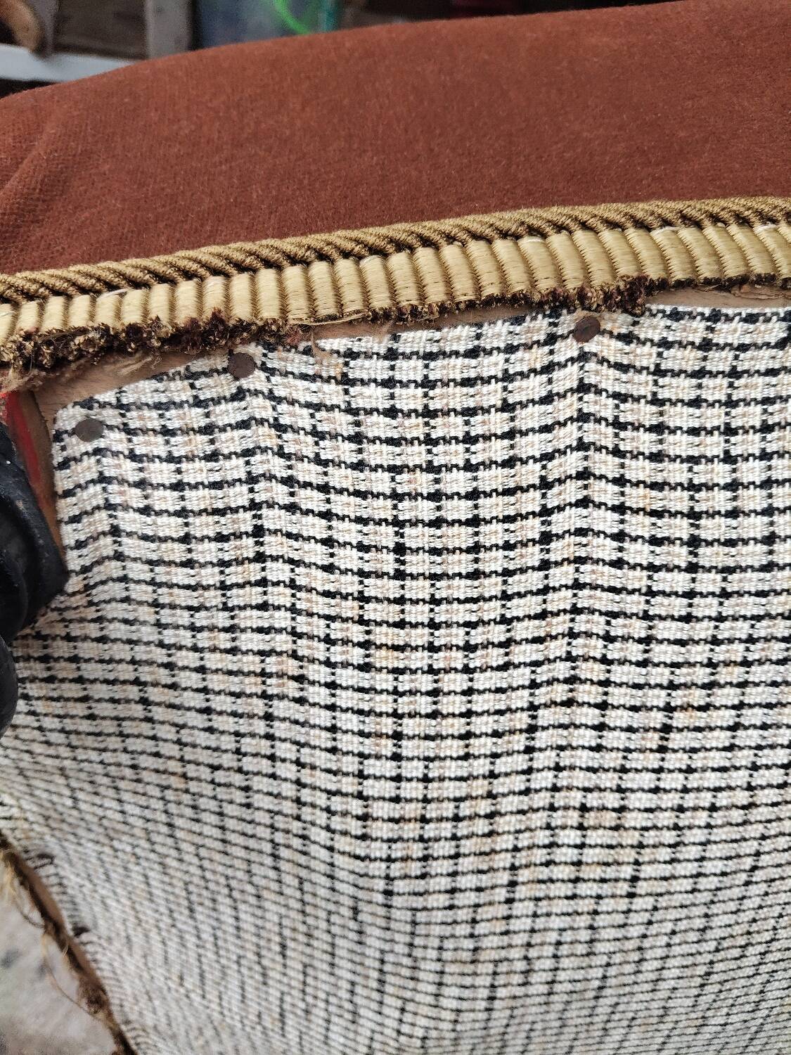Antique brown velvet tub chair – turned legs and brass rings.