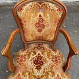 Louis XV armchair in carved solid wood and red and yellow fabric