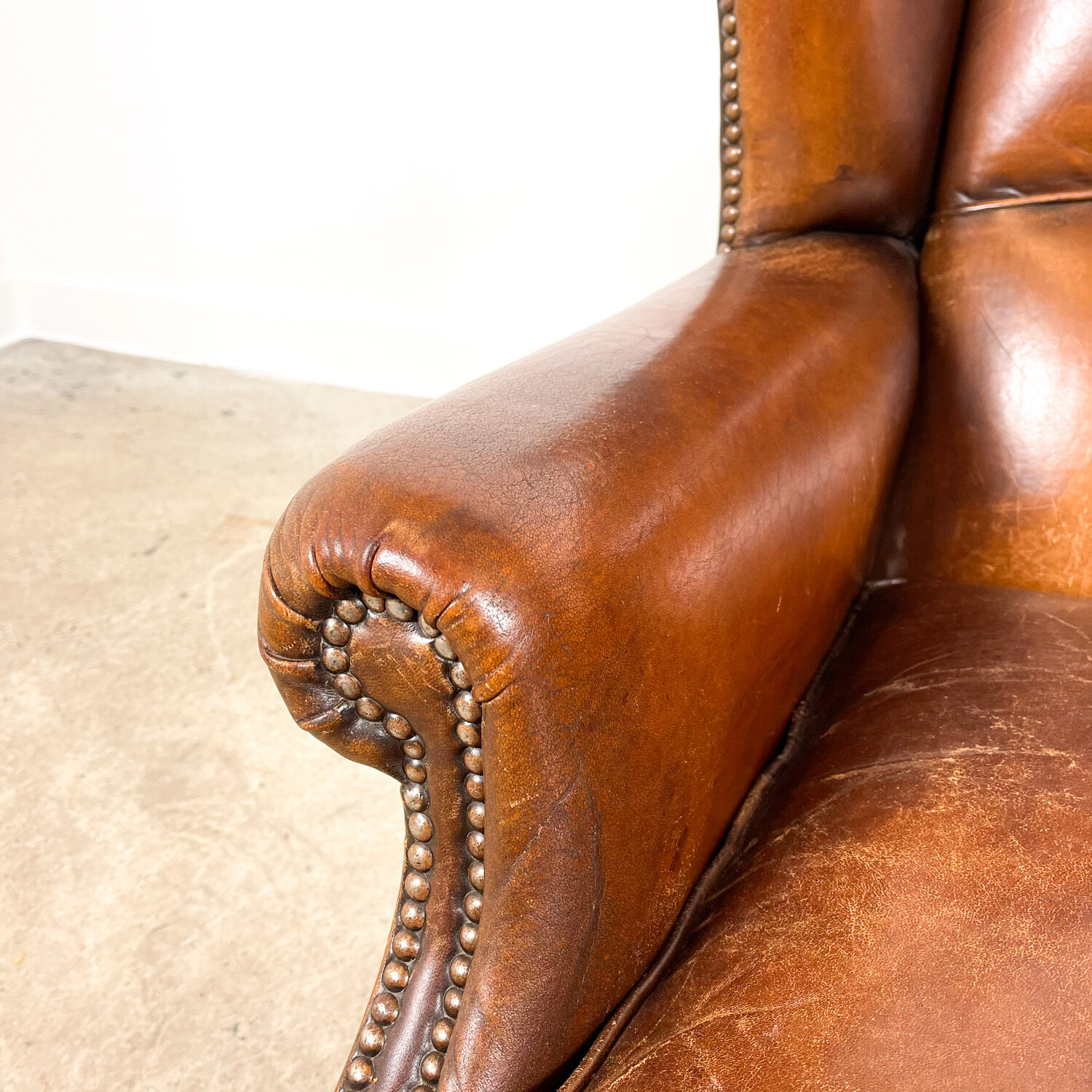 Dark brown sheep leather wingback armchair vintage