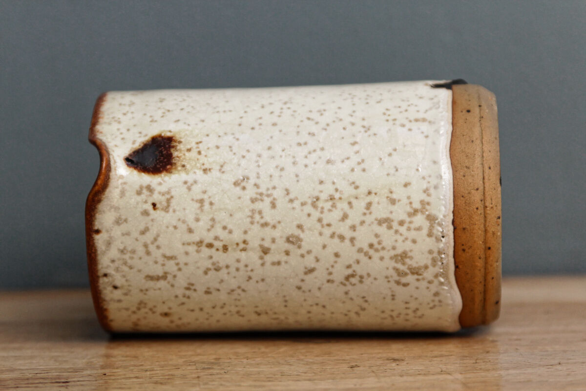 Enamelled sandstone milk jar, signed