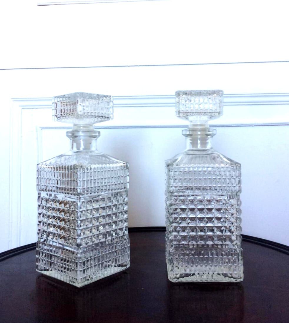Pair of vintage diamond-cut whiskey decanters