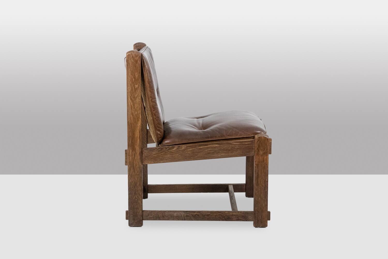 Pair of oak armchairs, upholstered in leather. Work from the 1960s.