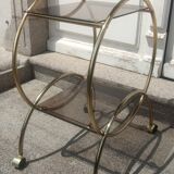 Service console with design / gilded metal wheels and smoked glass