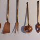 Old gilded brass and copper kitchen utensils