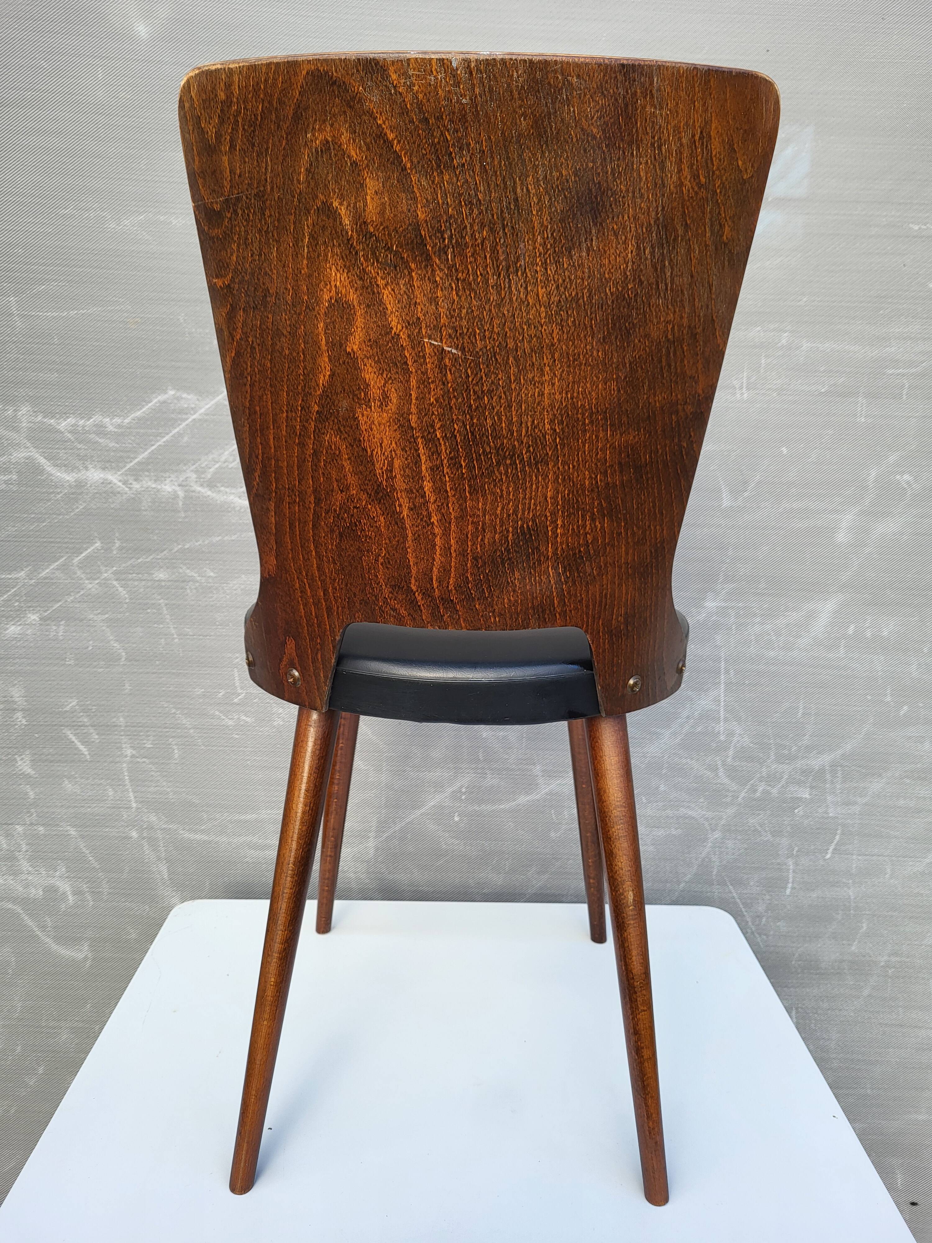 Pair of Dove chairs • Baumann • Black faux leather