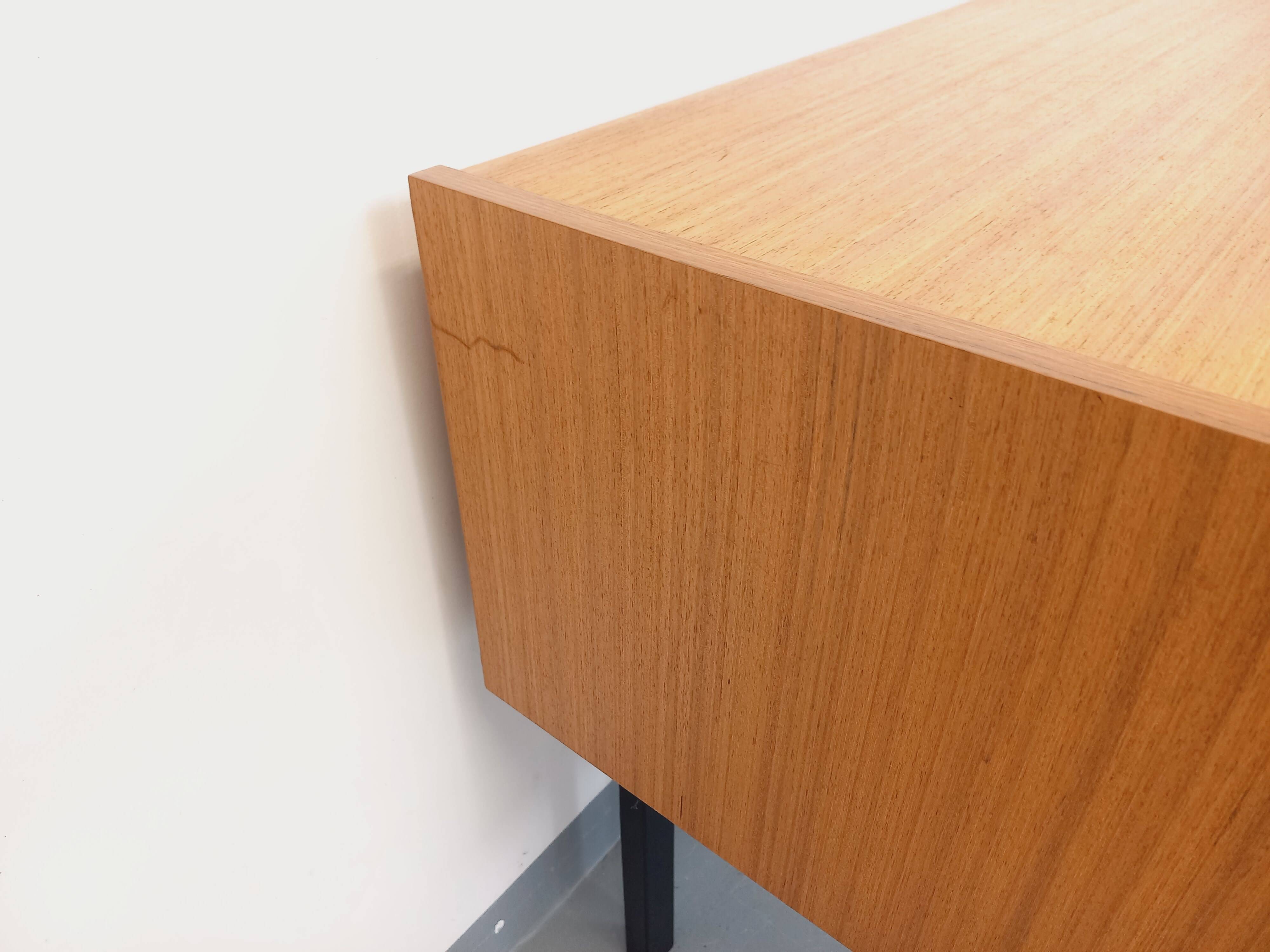 Vintage teak and black metal storage unit / chest on legs from the 70s