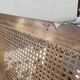 Cane-seated teak bench