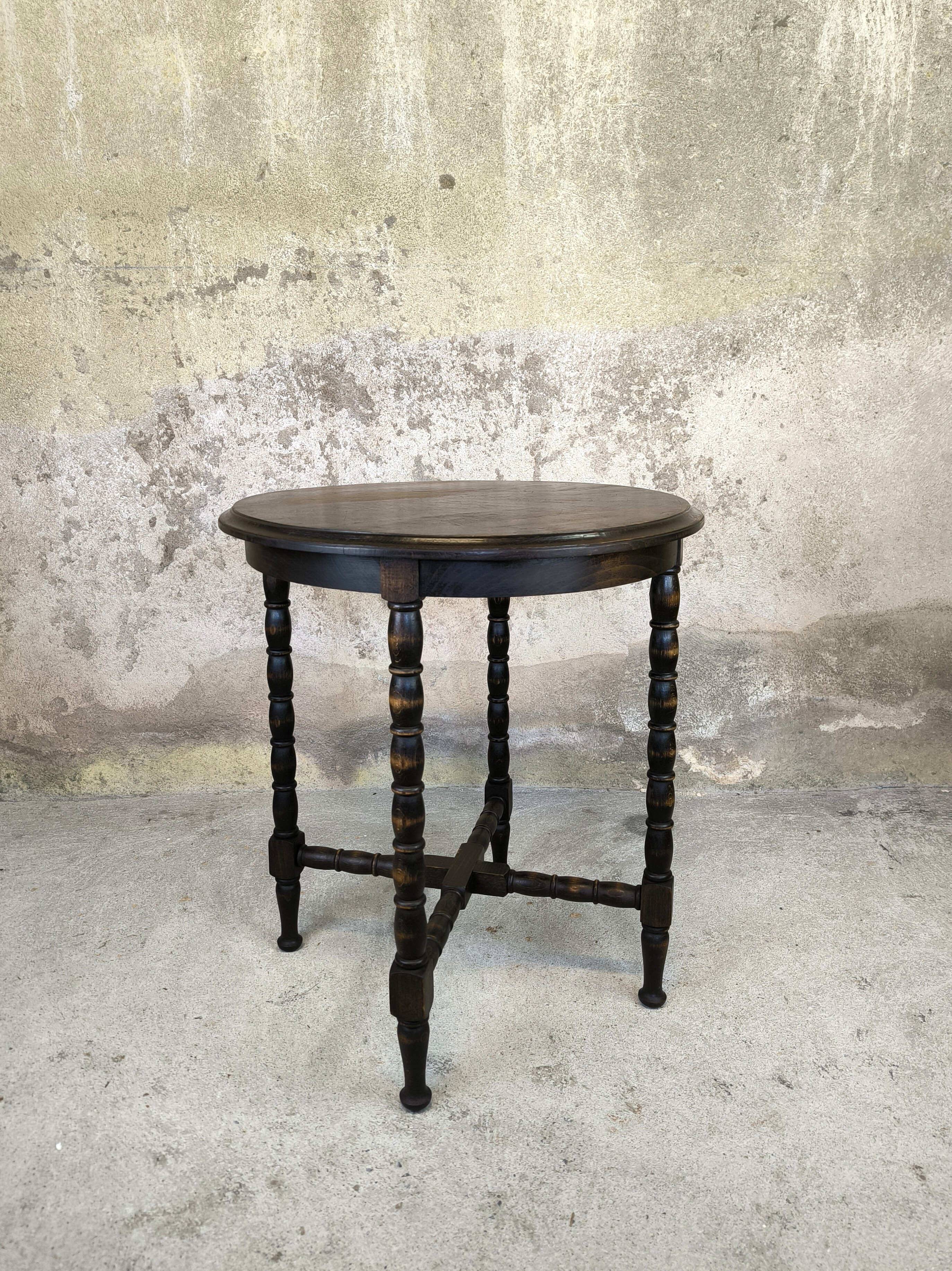 Vintage gueridon with beaded wooden legs.