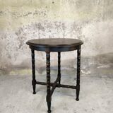 Vintage gueridon with beaded wooden legs.