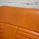 Sofa "space age". Leather, fiberglass, foam, steel. Circa 1970. Orange.