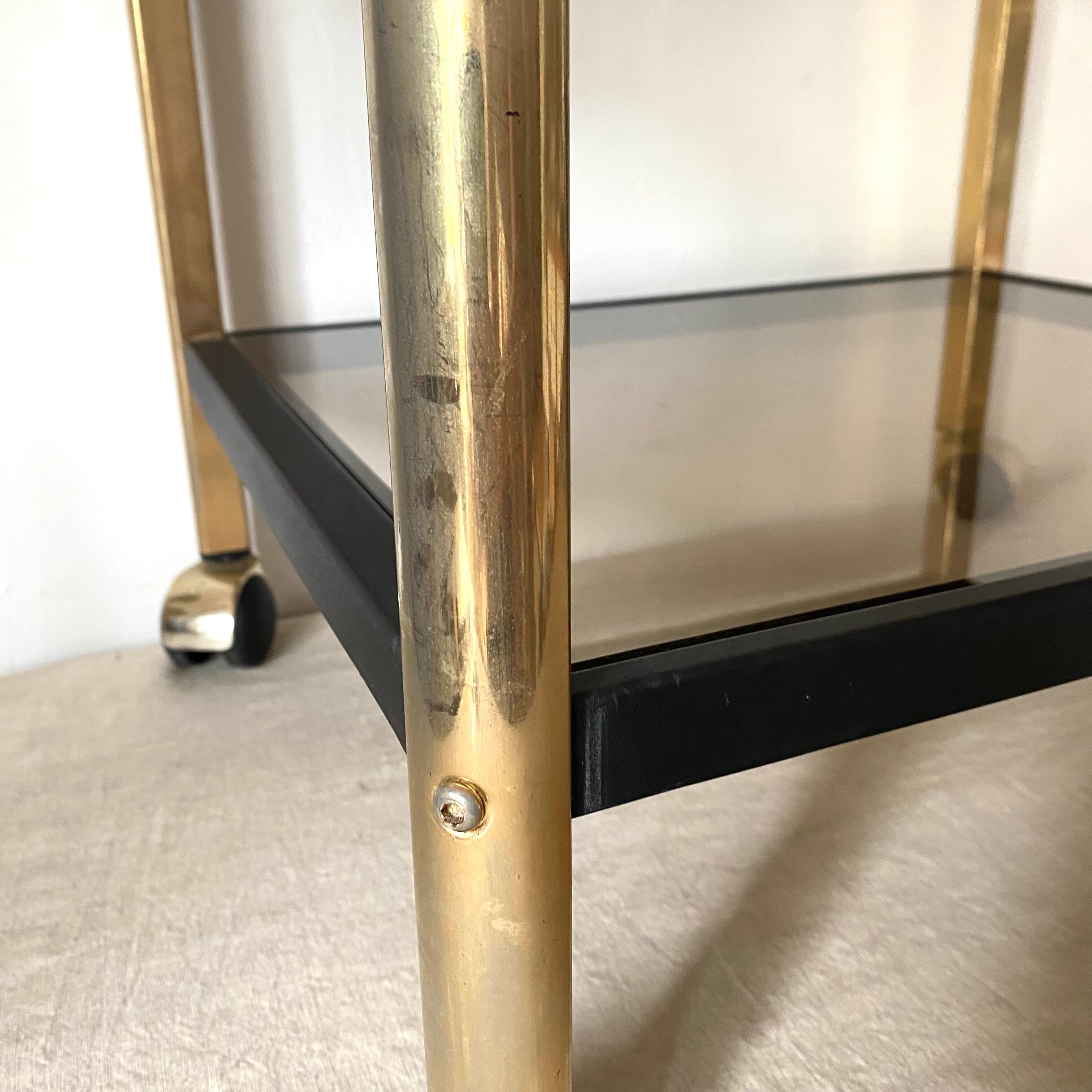 Serving with vintage wheels in metal and smoked glass