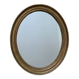 Old oval golden mirror