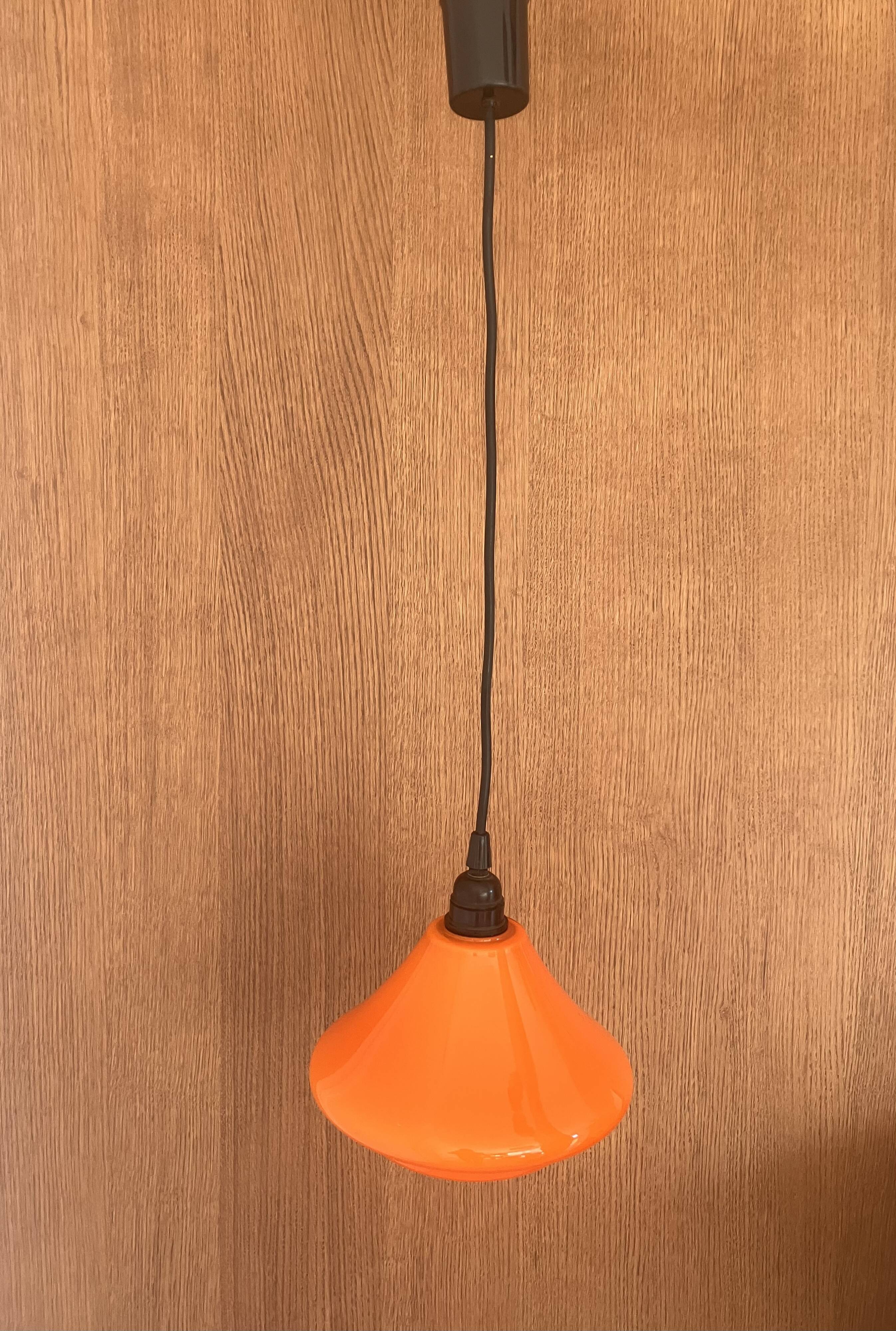 Set of three orange opaline suspensions from the 1970s Space Age.