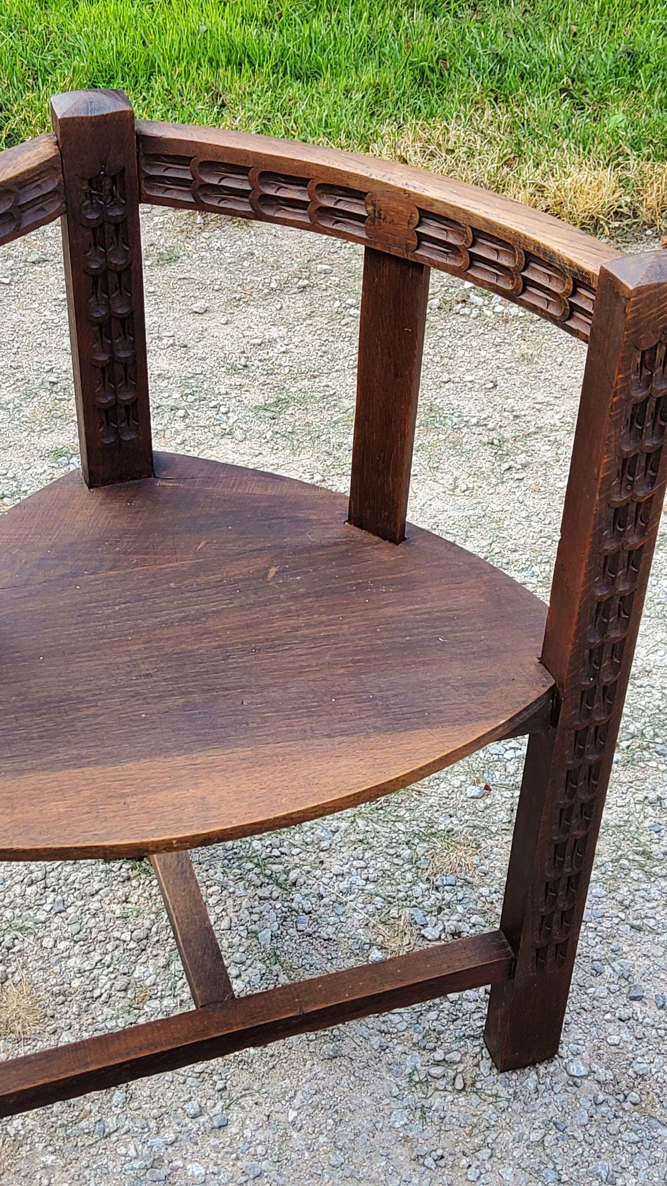 Set of three brutalist tripod armchairs in carved solid oak