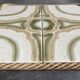 Ceramic tile trivet with vintage pattern woven wicker outline