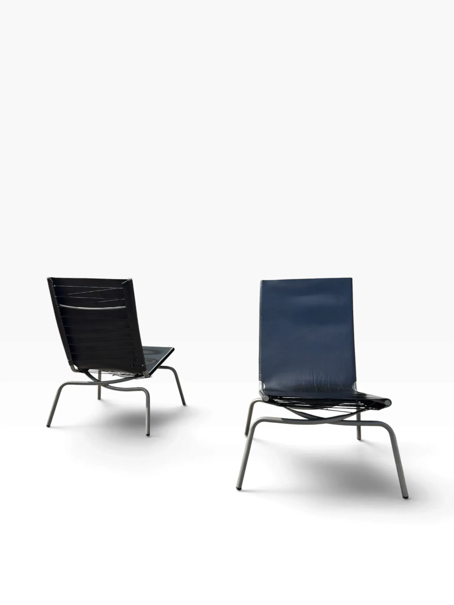 Set of 2 Crossed Legged lounge chairs by Fabiaan van Severen.