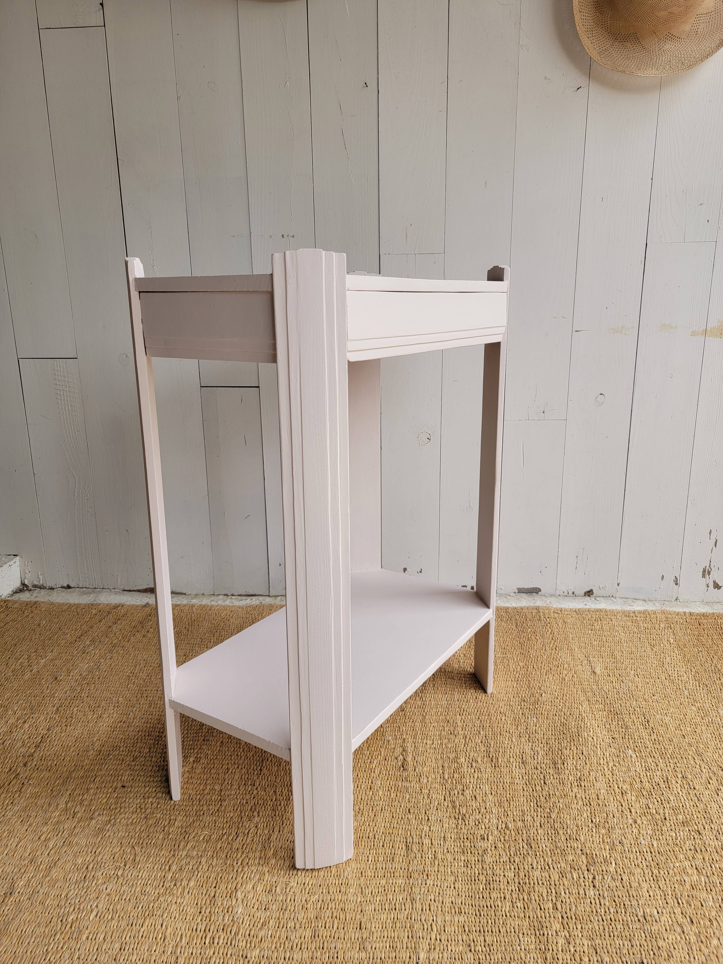 Small renovated Art Deco console in nude colour.