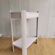 Small renovated Art Deco console in nude colour.