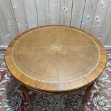 Round dining table with leather top in Louis XVI style.