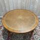 Round dining table with leather top in Louis XVI style.
