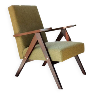 Vintage armchair in moss green bouclé design by H. Lis.