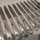 12 silver-plated dessert knives by Platil, rocaille style