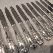 12 silver-plated dessert knives by Platil, rocaille style