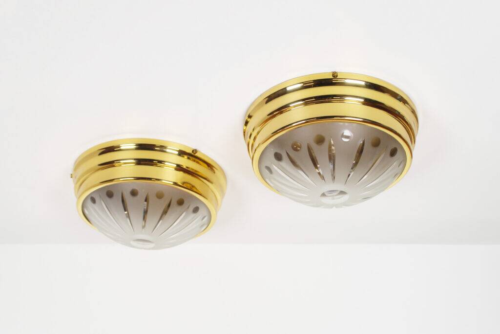 Pair of vintage brass ceiling lights with glass globe