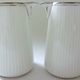 Pair of creamers in white porcelain enhanced with platinum