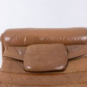 Lounge chair and ottoman, in blond elm and leather. 1970s