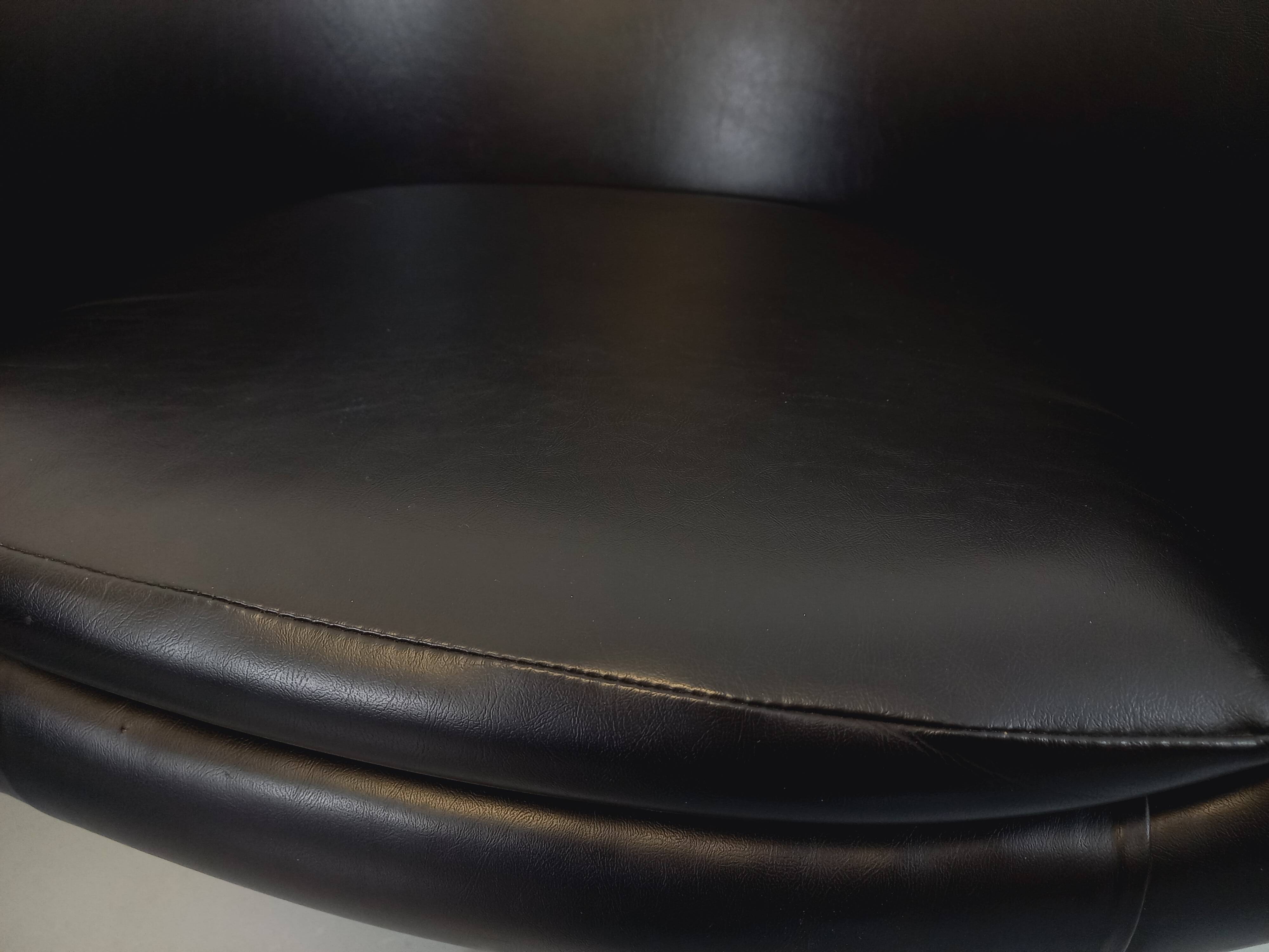 Pair of vintage Scandinavian swivel armchairs in faux leather and chrome.