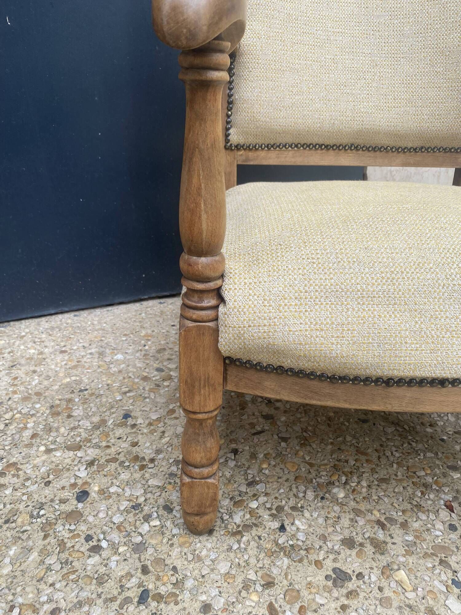 Pair of wooden and cream fabric armchairs